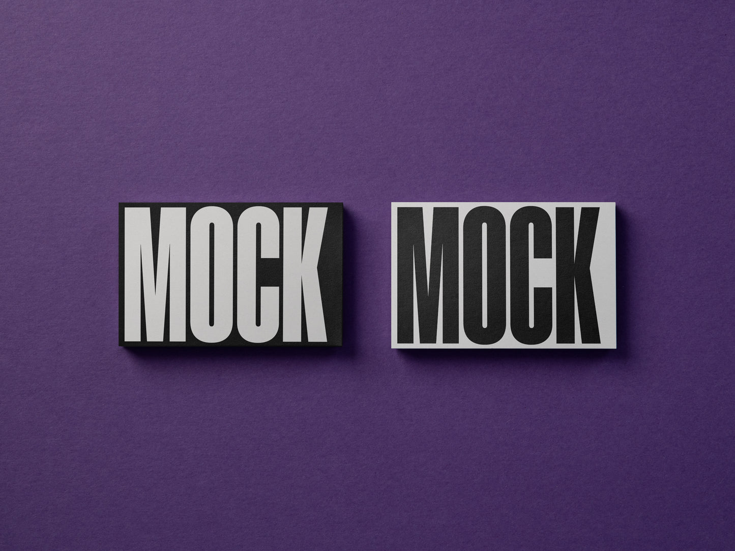 Two centered business cards mockup with 'MOCK' text and dark edges