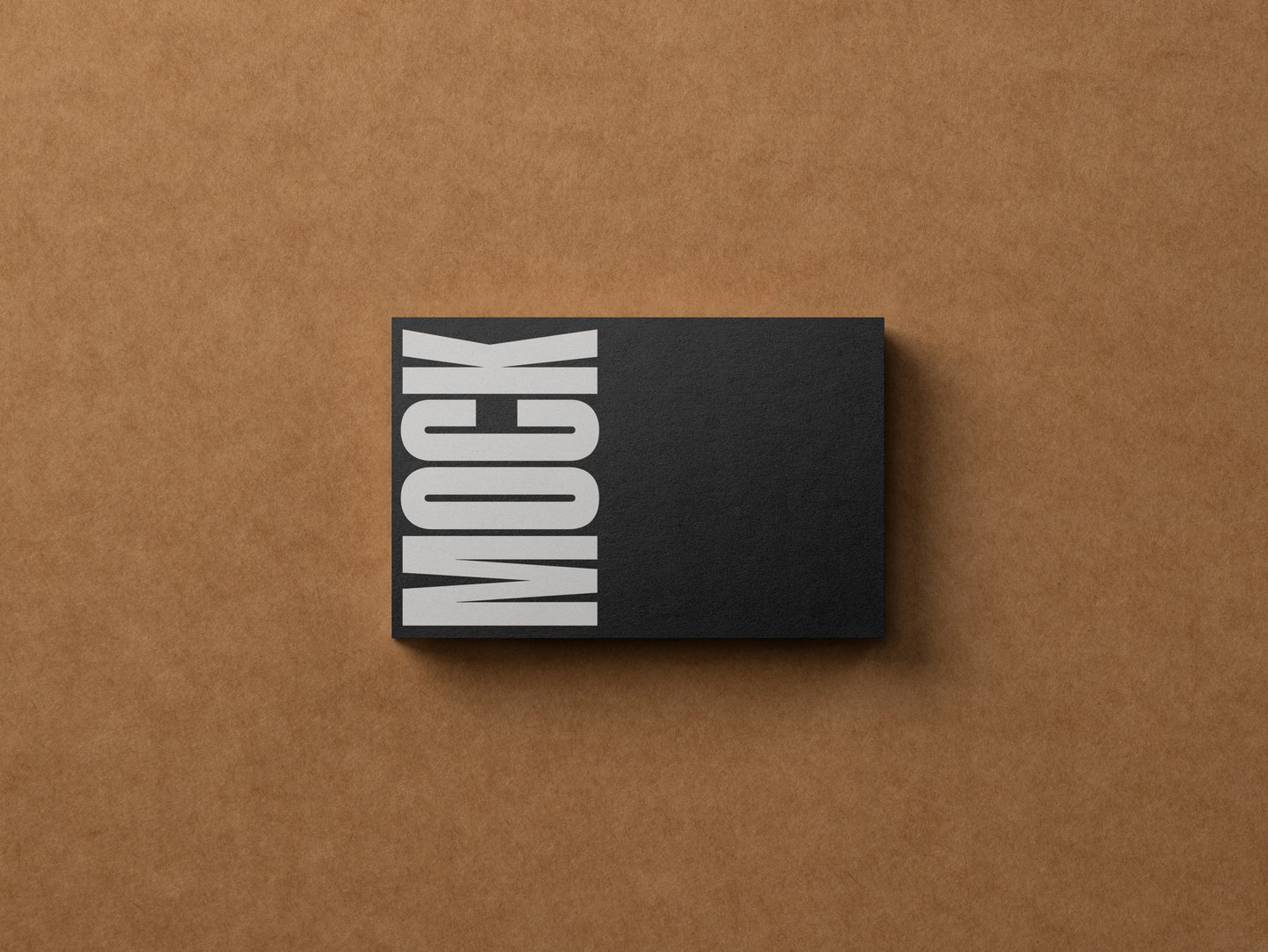 Black business card mockup with vertical MOCK lettering in gray and white