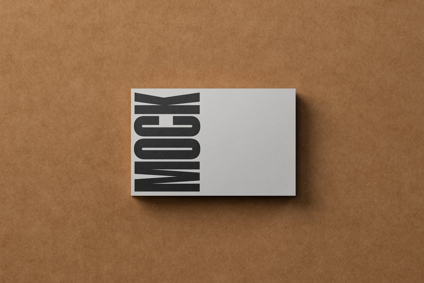 Small business card mockup with vertical MOCK lettering in black and white