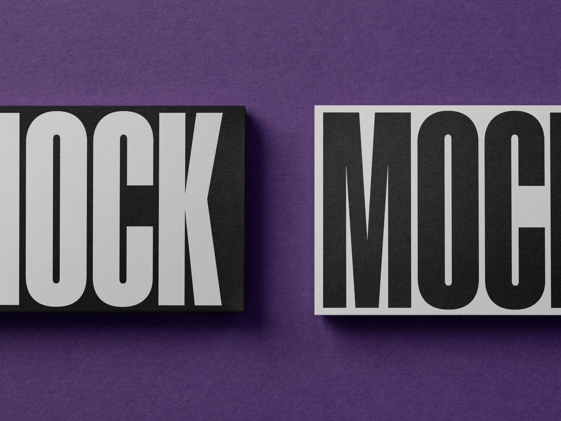 Close-up business cards mockup with bold 'MOCK' lettering on cards
