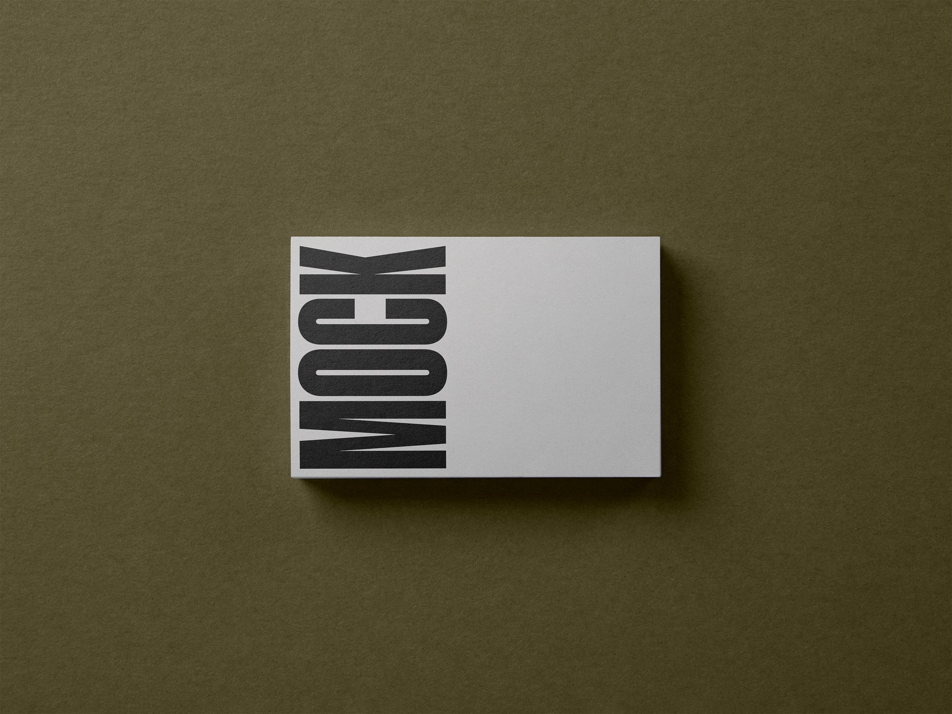 White business card mockup with vertical MOCK lettering, centered