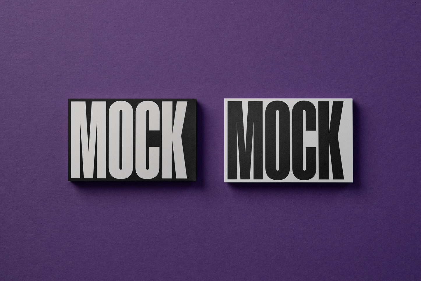 Two business cards mockup on a paper background