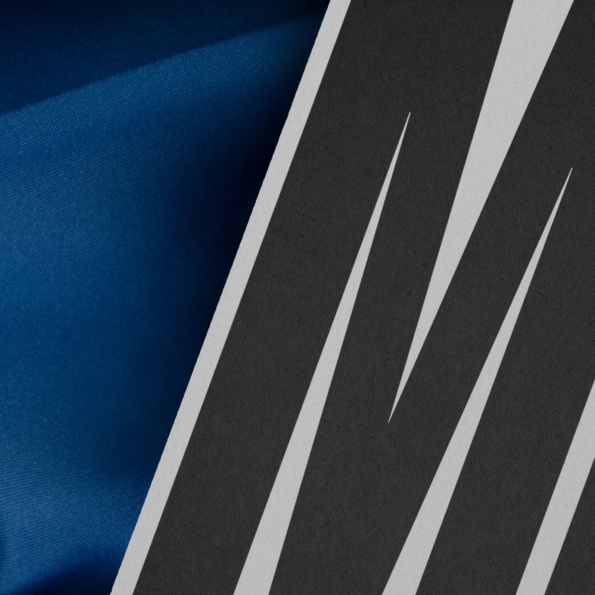 High-quality branding mockup featuring stationery print items, showing a poster on a blue background made of cloth fabric. Created by Sylvan Hillebrand.
