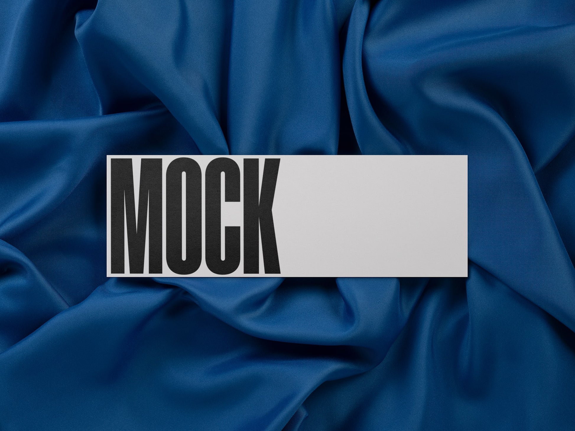 High-quality branding mockup featuring stationery print items, showing a ticket card on a blue background made of cloth fabric. Created by Sylvan Hillebrand.